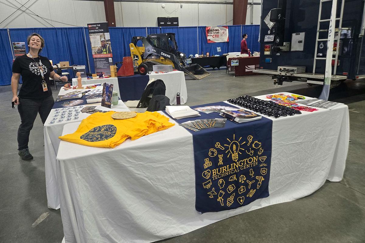 A Burlington Technical Center booth with printed pieces and other materials on display